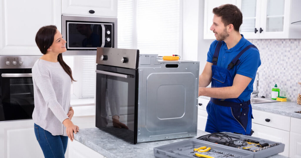customer and technician with oven