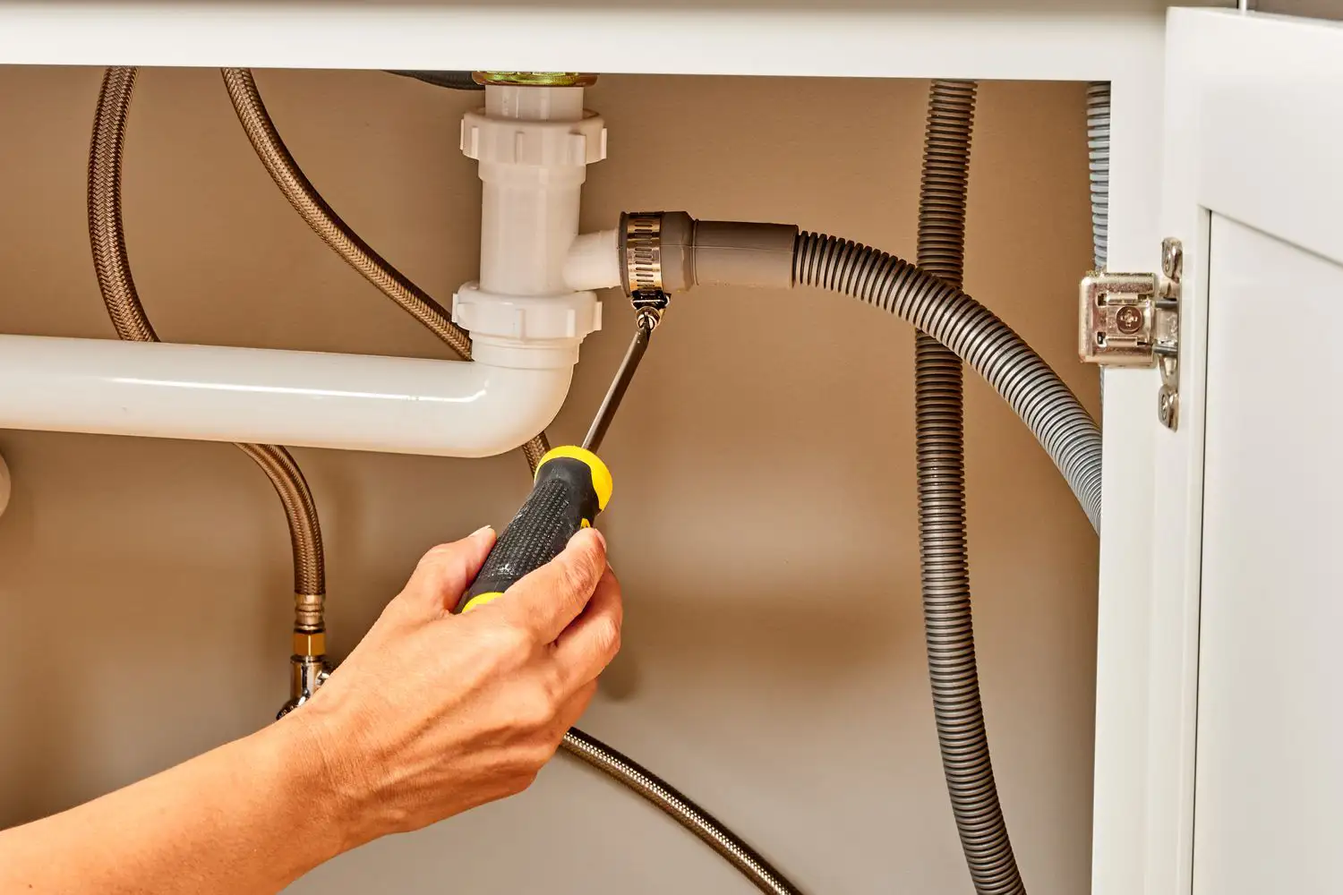 Our tech Inspect the Drain Hose
